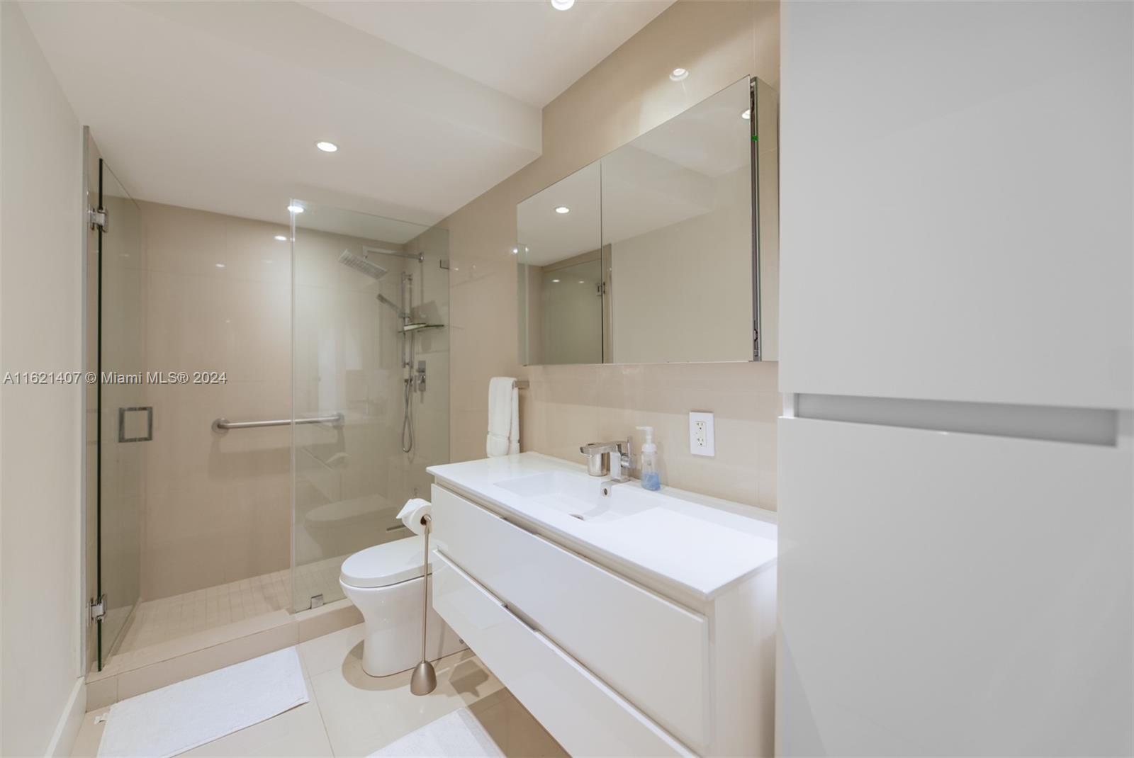 1950 South Ocean Drive, Unit 19G Hallandale Beach, FL 33009 - Photo 16 of 33 a bathroom with a sink toilet and shower