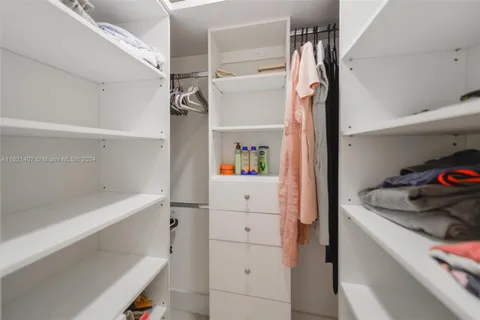 a kitchen with a refrigerator and a cabinets