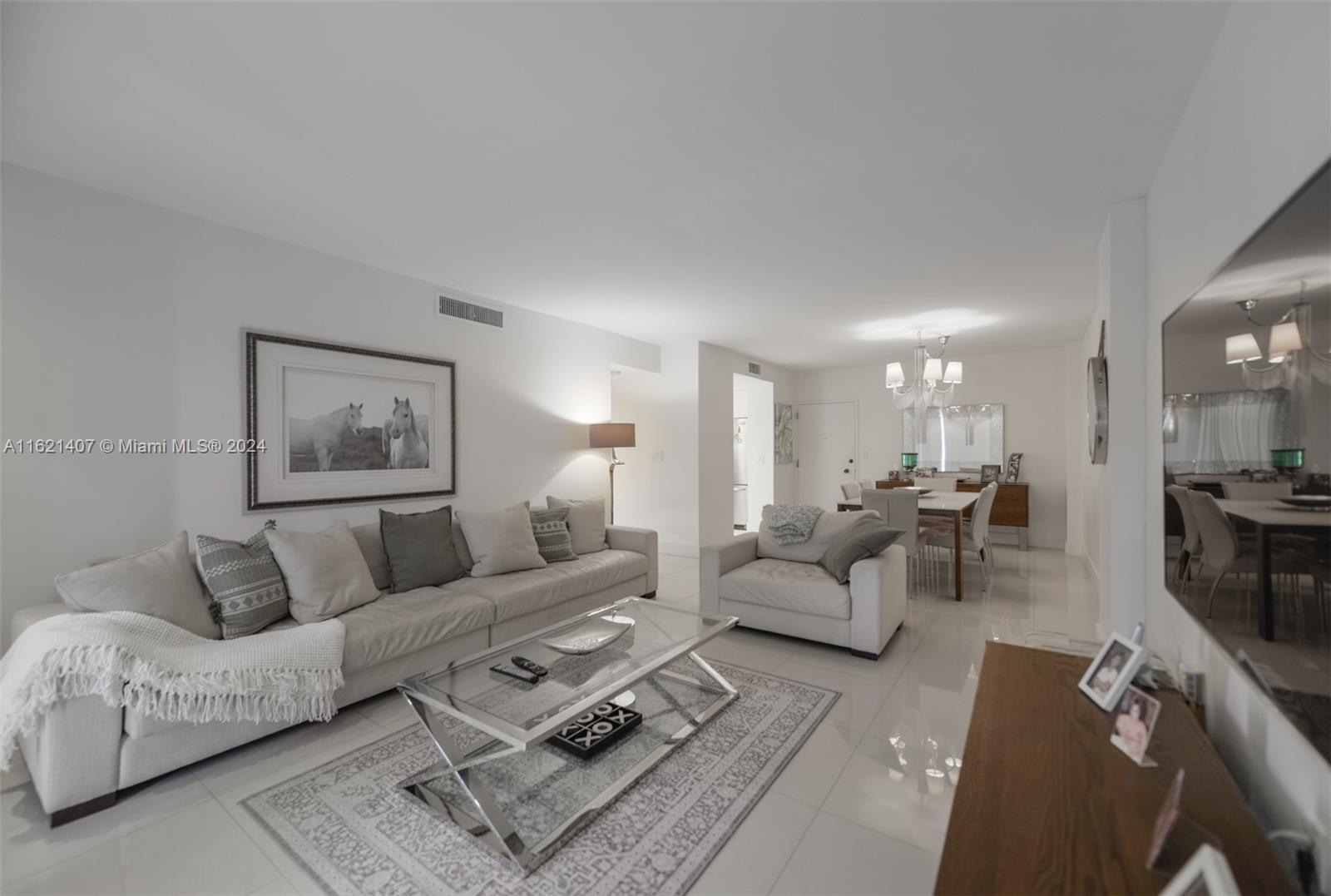 1950 South Ocean Drive, Unit 19G Hallandale Beach, FL 33009 - Photo 7 of 33 a living room with furniture and a couch