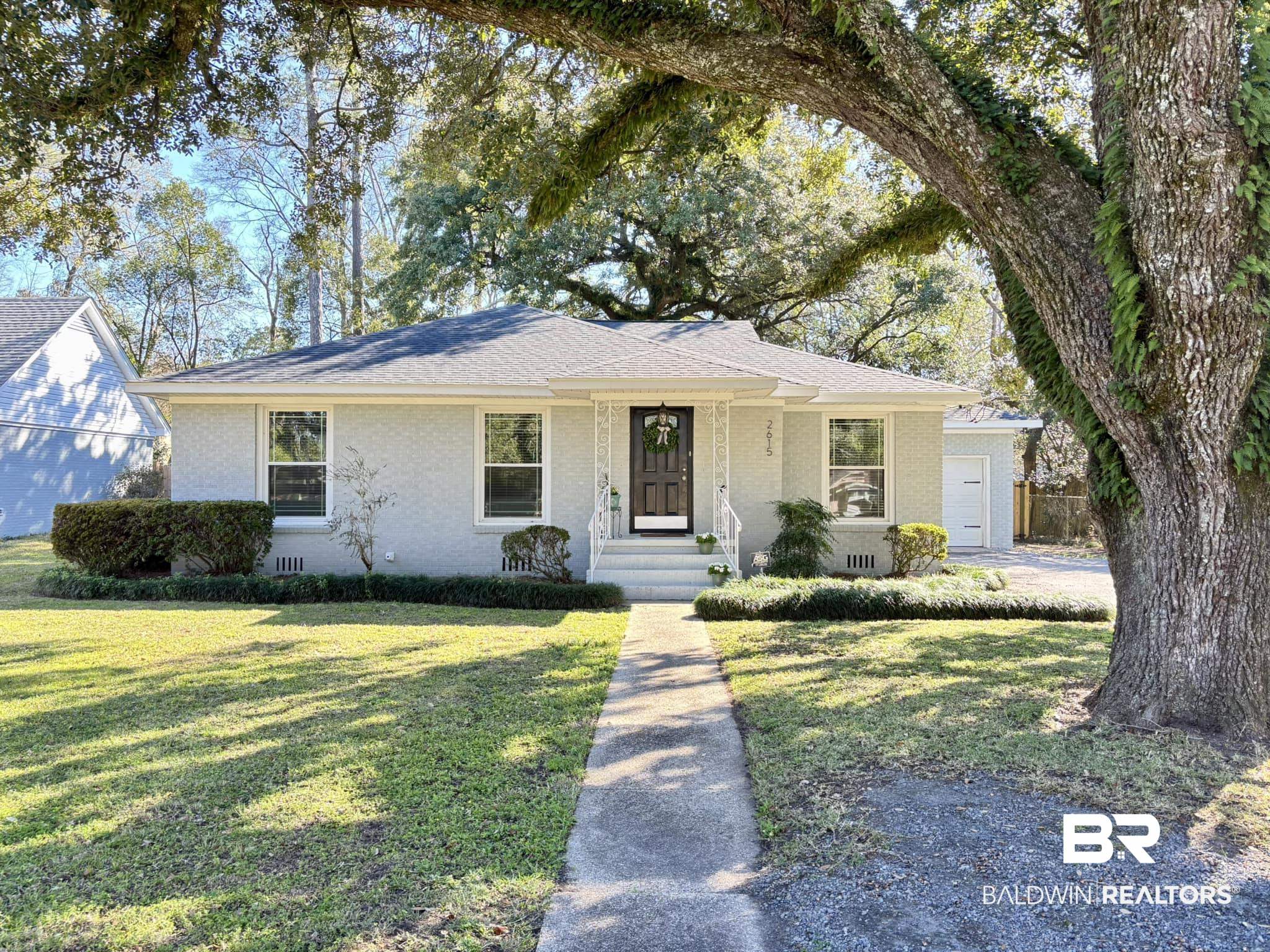2615 Walton Avenue Mobile, AL 36606 - Photo 1 of 33 Ranch-style home featuring crawl space, a shingled roof, a front yard, and brick siding