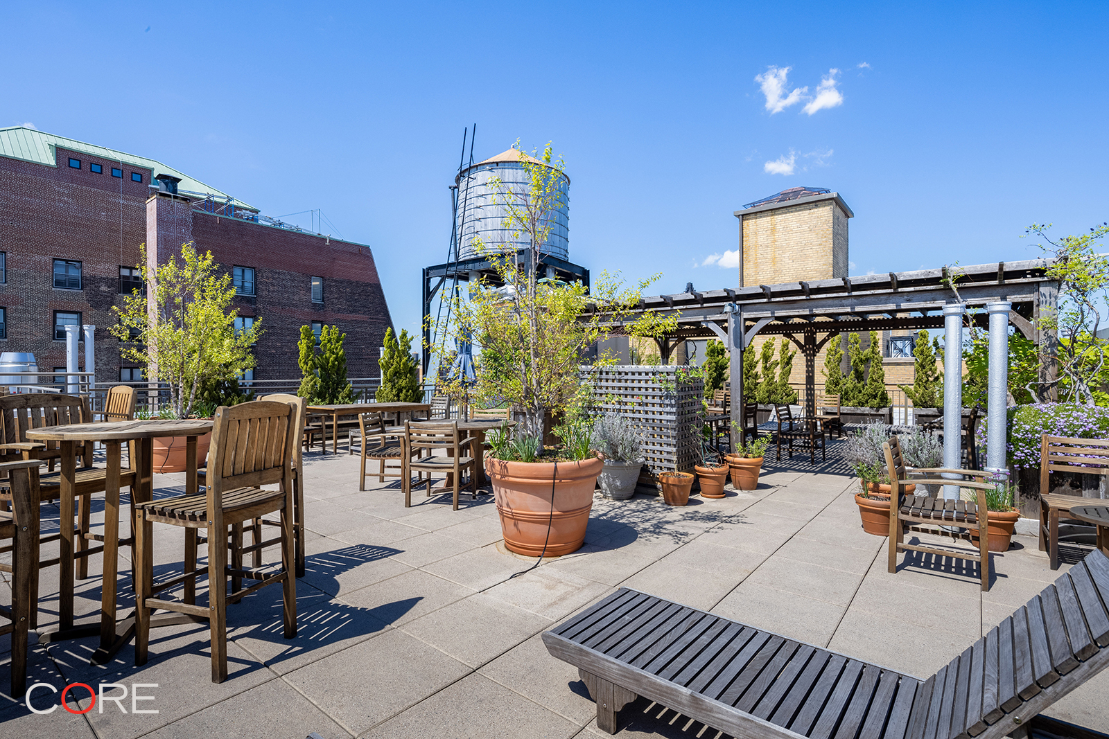 230 West 105th Street, Unit 5AA Manhattan, NY 10025 - Photo 4 of 9 a view of balcony with chairs and potted plants