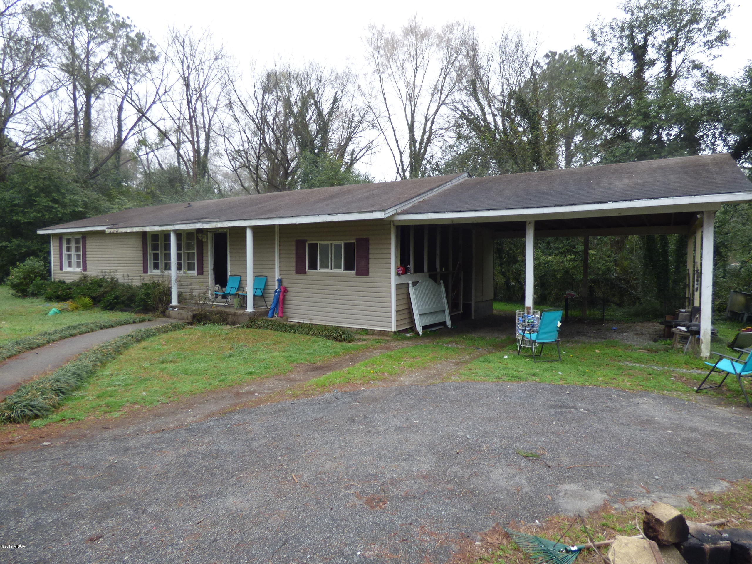 5542 Houston Road Macon, GA 31216 - Photo 1 of 5 a view of a house with yard and garden