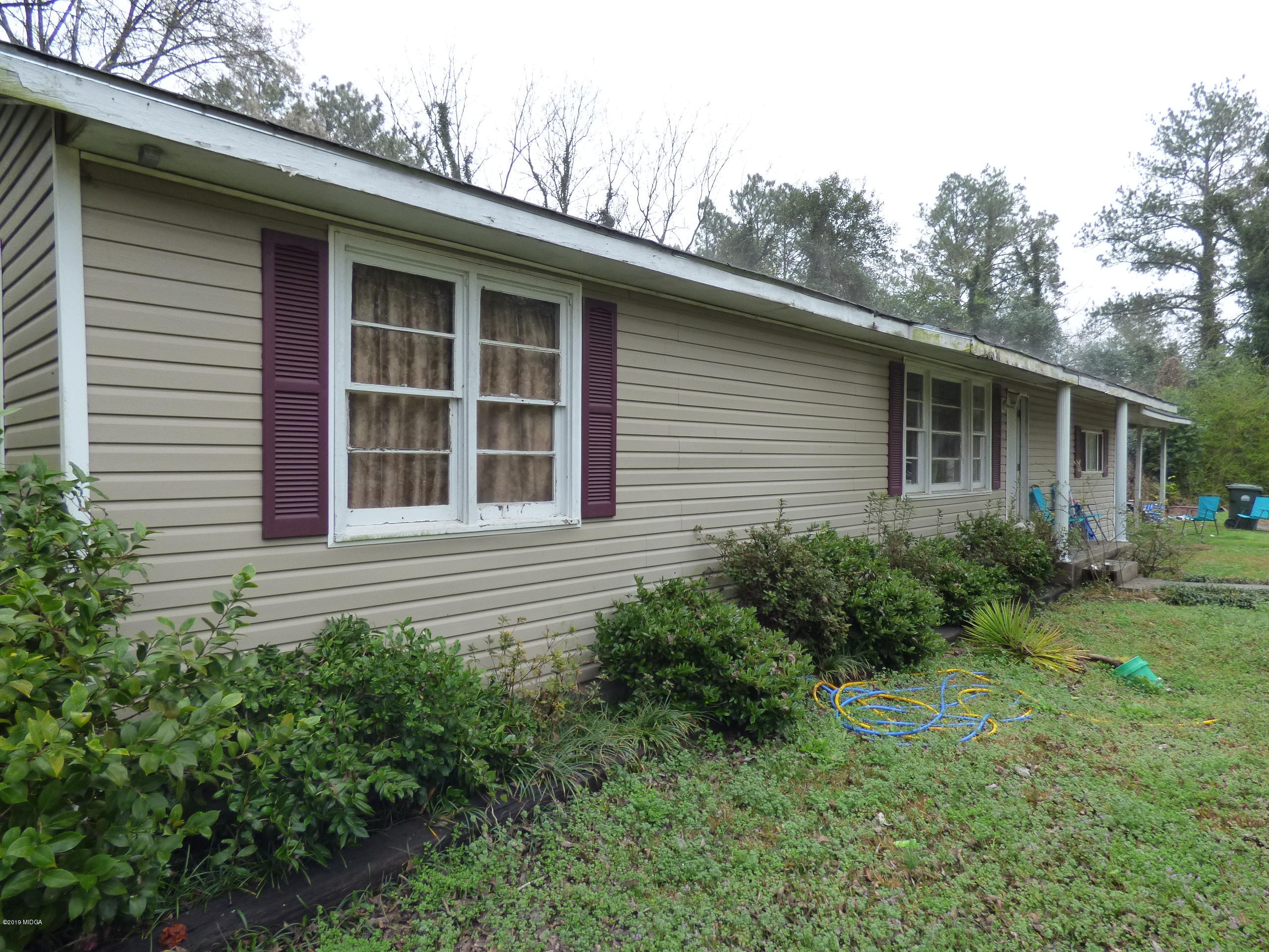 5542 Houston Road Macon, GA 31216 - Photo 5 of 5 a house view with a garden space