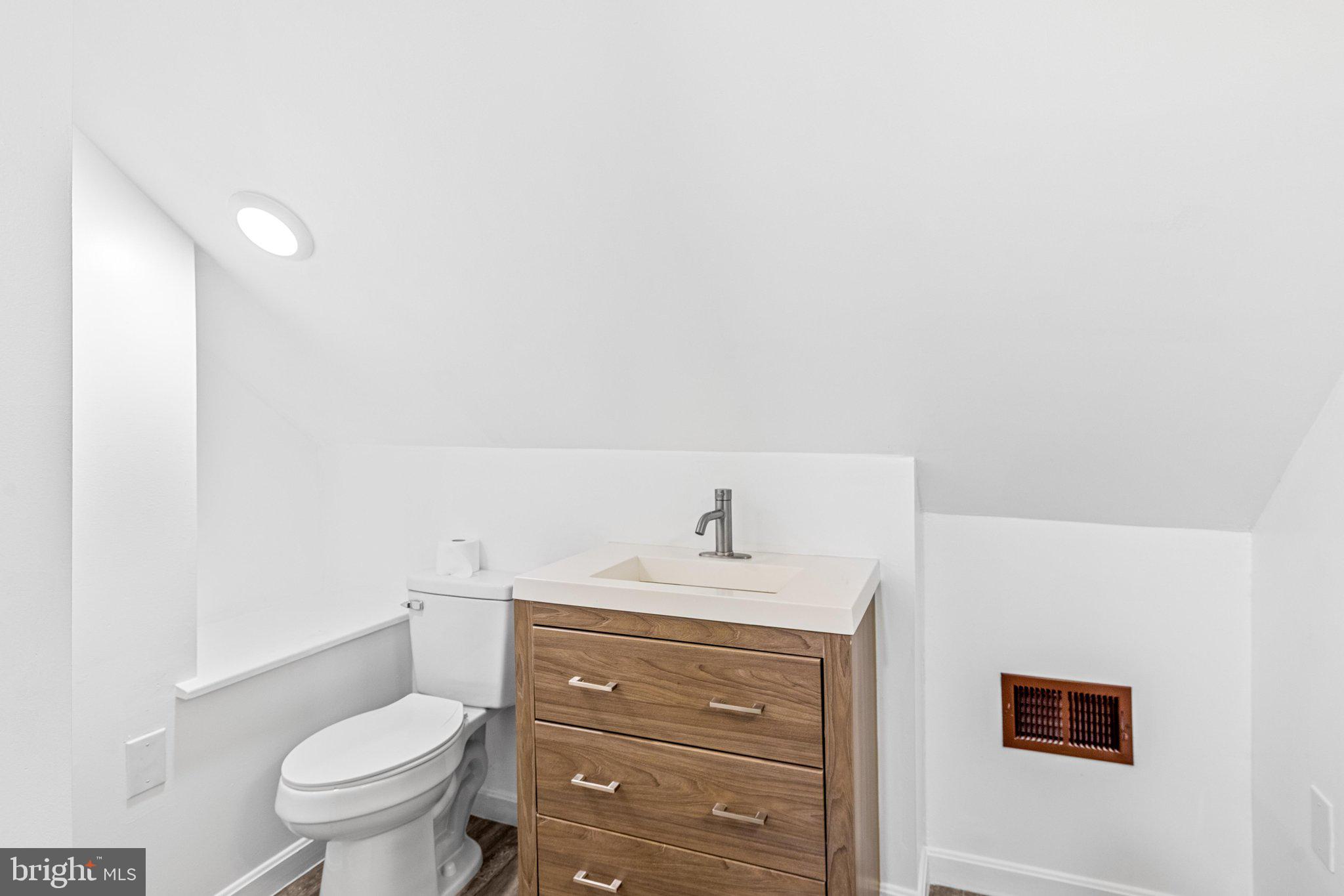 15 Raft Road Ocean Pines, MD 21811 - Photo 13 of 53 a bathroom with a sink a toilet and a vanity