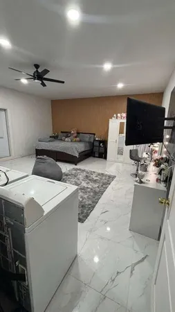 a kitchen with a stove a sink and a refrigerator