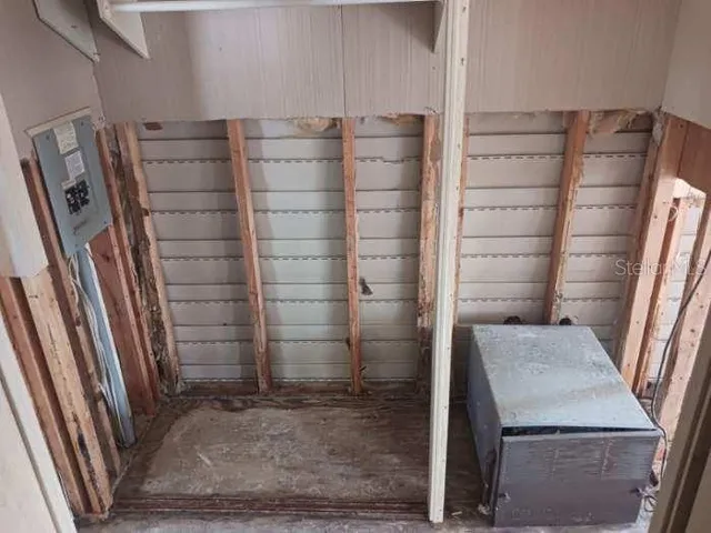 a view of walk in closet with clothes