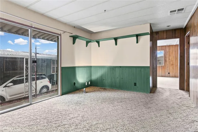 a large kitchen with stainless steel appliances kitchen island granite countertop a sink stove and cabinets