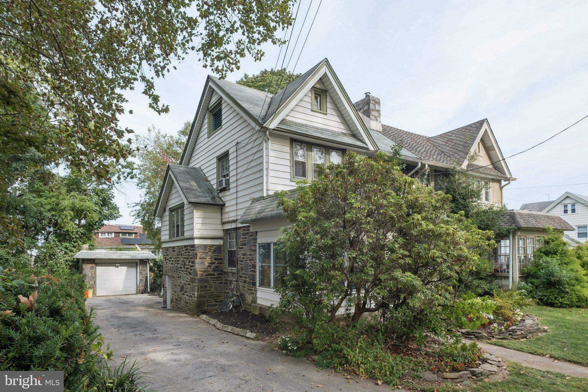 7209 Hilltop Road Upper Darby, PA 19082 - Photo 3 of 33 a view of a house with a yard and plants