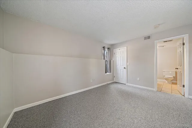 a view of hallway with white walls