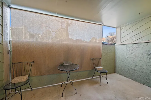 a big house with a tree in front of it