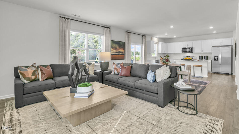 632 Ramo Grande Drive Wake Forest, NC 27587 - Photo 13 of 41 a living room with furniture and a large window
