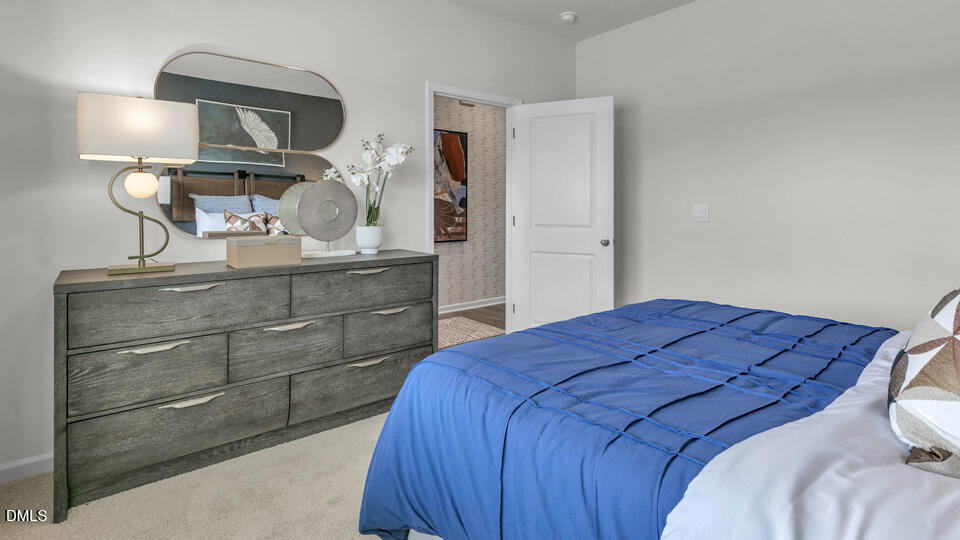 632 Ramo Grande Drive Wake Forest, NC 27587 - Photo 24 of 41 a bedroom with a bed and a dresser