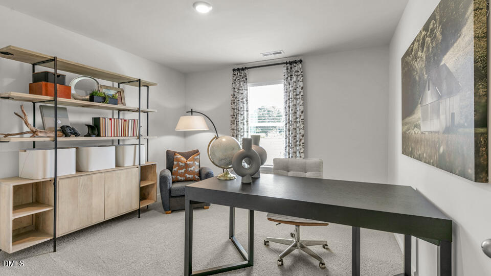 632 Ramo Grande Drive Wake Forest, NC 27587 - Photo 3 of 41 a view of a workspace with furniture and a window