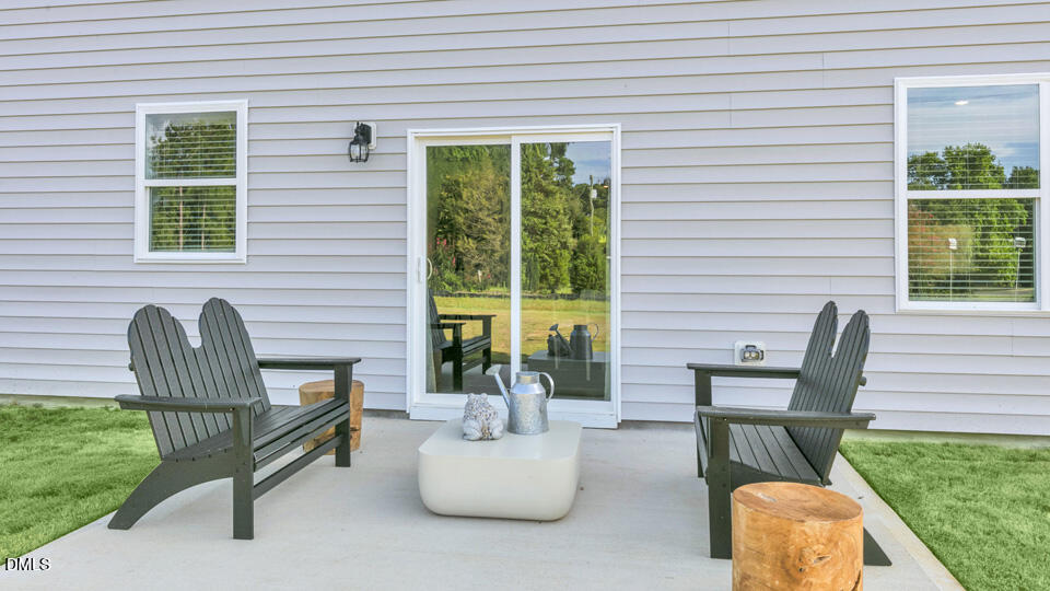 632 Ramo Grande Drive Wake Forest, NC 27587 - Photo 33 of 41 a balcony with furniture and a potted plant