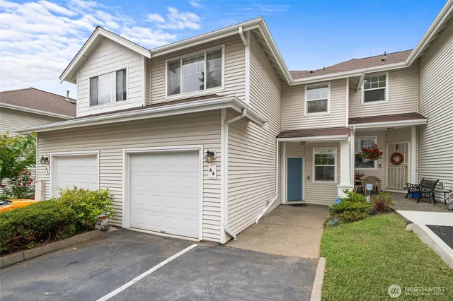 a view of a house with a yard and plants