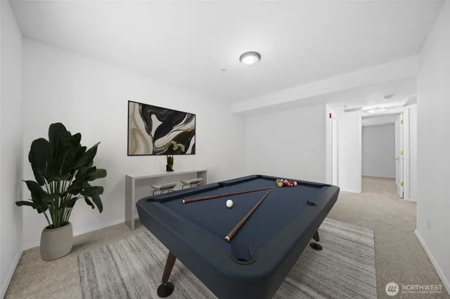 a living room with furniture and potted plant