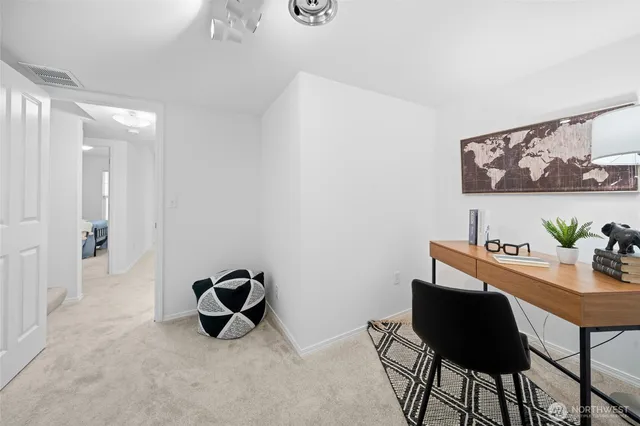 a workspace with furniture and rug