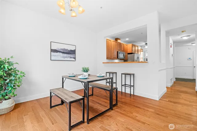 a view of a dining room with furniture and wooden floor