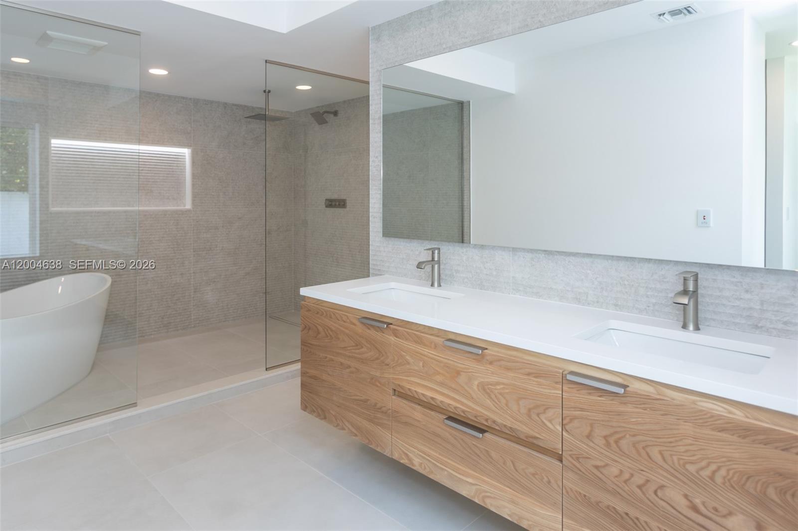 1690 Daytonia Road Miami Beach, FL 33141 - Photo 63 of 88 a bathroom with a sink a toilet and shower