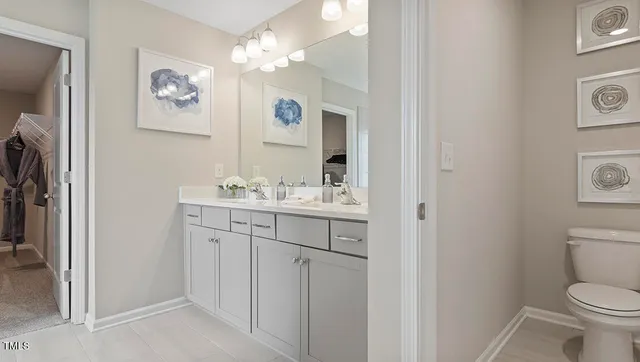 a bathroom with a double vanity sink mirror and shower
