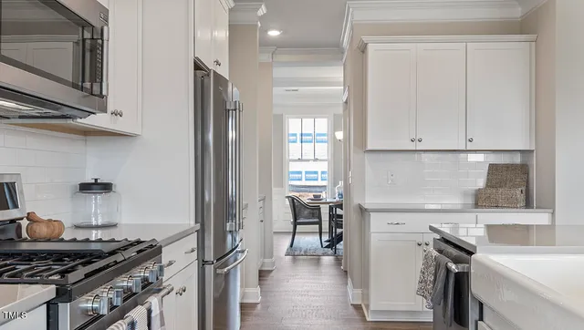 a kitchen with a stove and a microwave