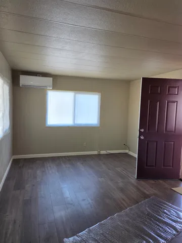 a view of a porch with furniture and garden