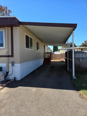 a view of a house with a tree