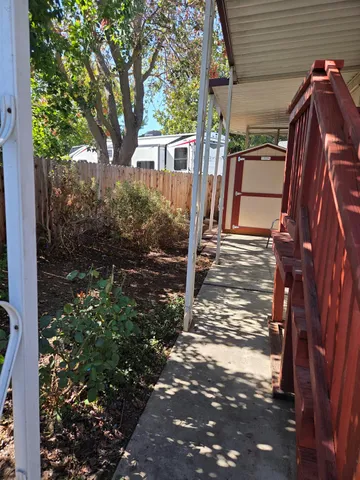 a kitchen with stainless steel appliances a refrigerator and a stove top oven