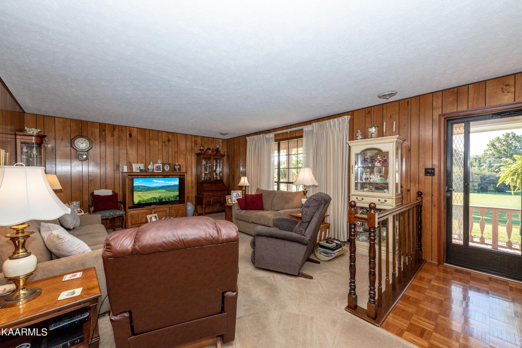 185 New Center Road Sevierville, TN 37876 - Photo 3 of 45 a living room with furniture a flat screen tv and a large window