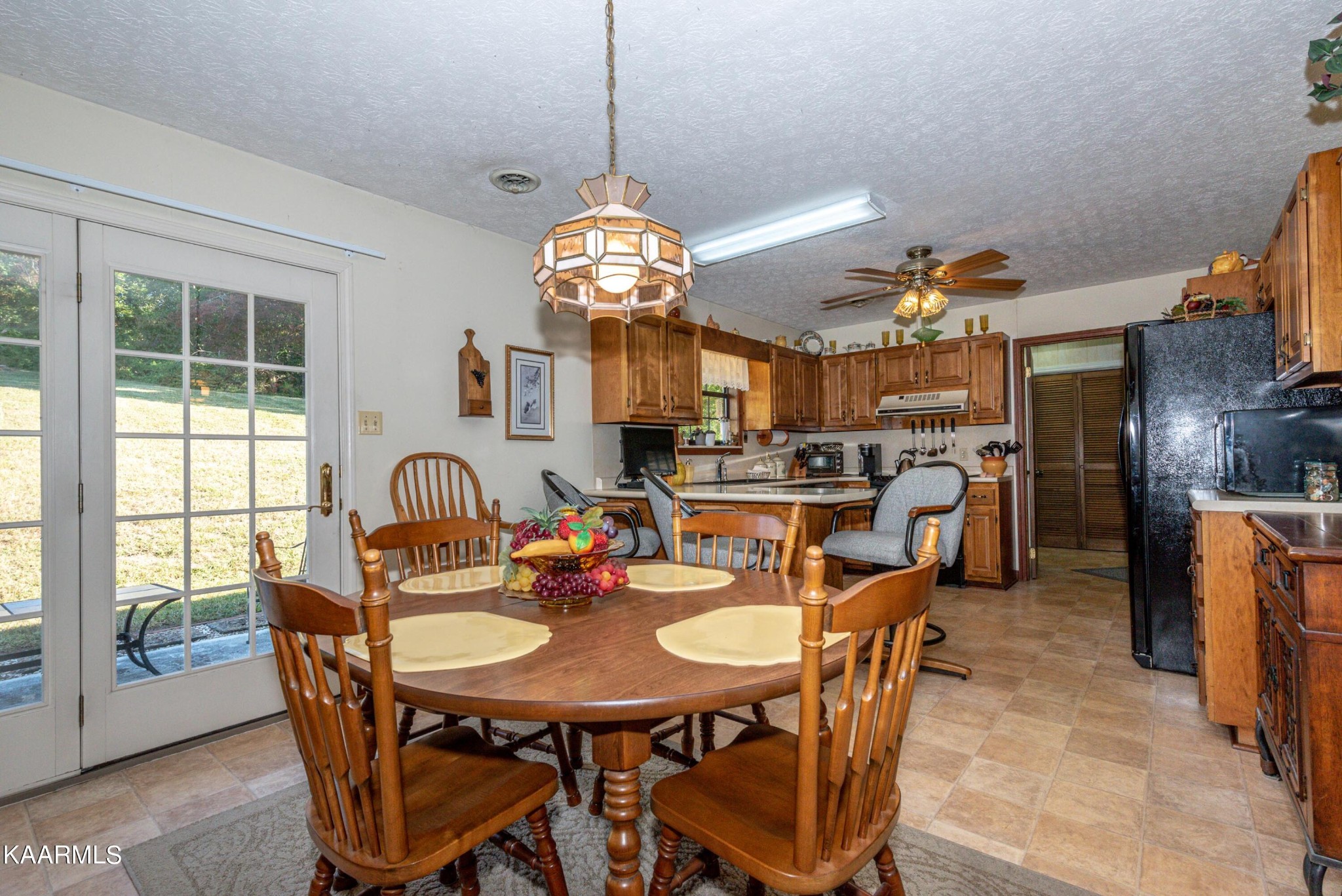 185 New Center Road Sevierville, TN 37876 - Photo 8 of 45 a view of a dining room and livingroom with furniture wooden floor a chandelier
