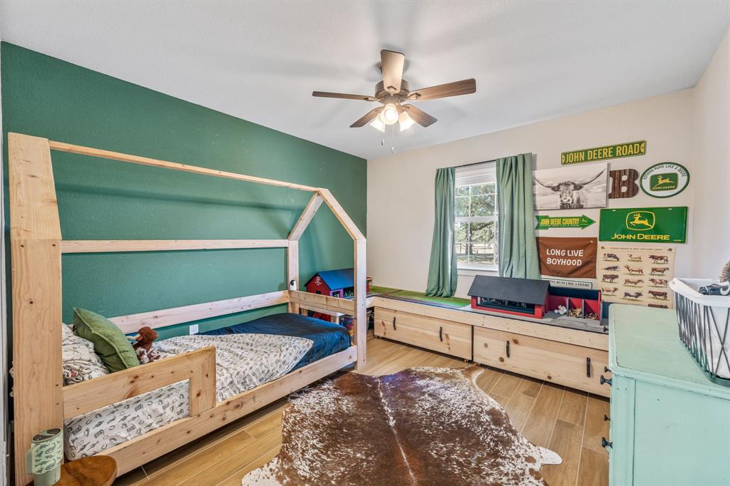 7772 County Road 179 Stephenville, TX 76401 - Photo 11 of 37 a bedroom with bed and a window