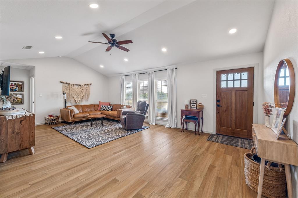 7772 County Road 179 Stephenville, TX 76401 - Photo 2 of 37 a living room with furniture and wooden floor