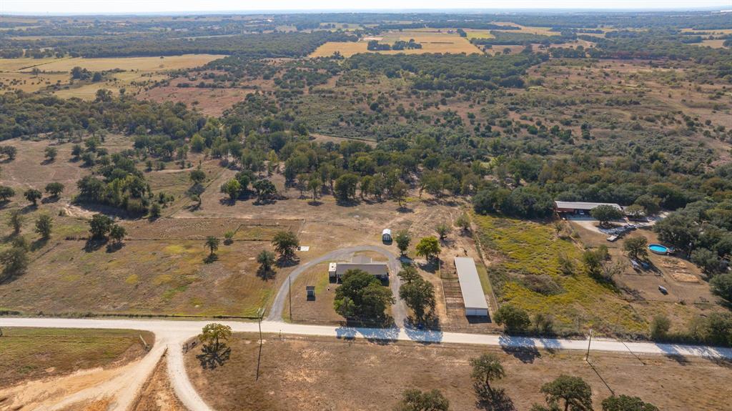 7772 County Road 179 Stephenville, TX 76401 - Photo 26 of 37 an aerial view of residential houses with outdoor space