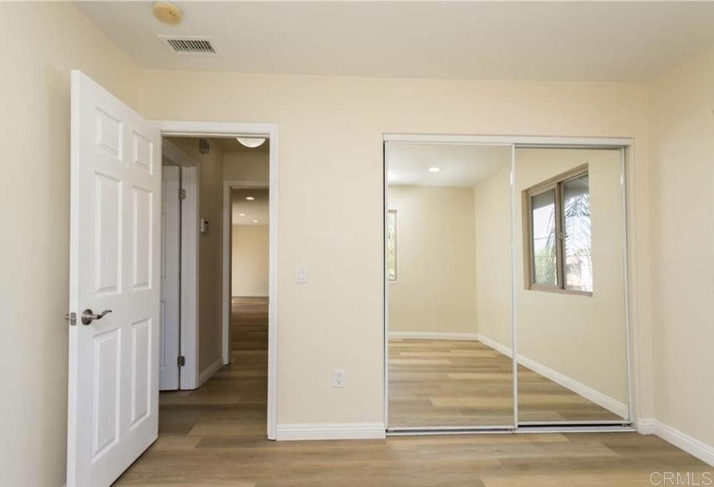 1069 Estes Street El Cajon, CA 92020 - Photo 13 of 41 wooden floor with white walls