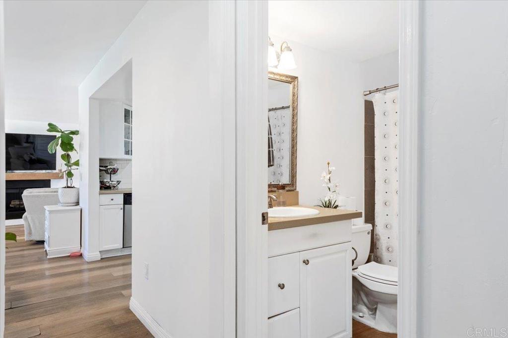 1069 Estes Street El Cajon, CA 92020 - Photo 24 of 35 a bathroom with a sink a toilet and a mirror