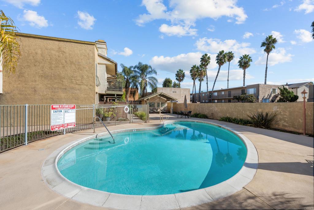 1069 Estes Street El Cajon, CA 92020 - Photo 33 of 41 a view of a swimming pool with a house