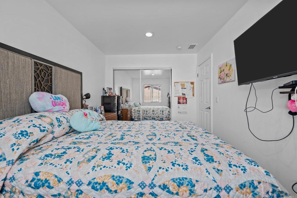 1069 Estes Street El Cajon, CA 92020 - Photo 40 of 41 a bedroom with a bed and a flat screen tv