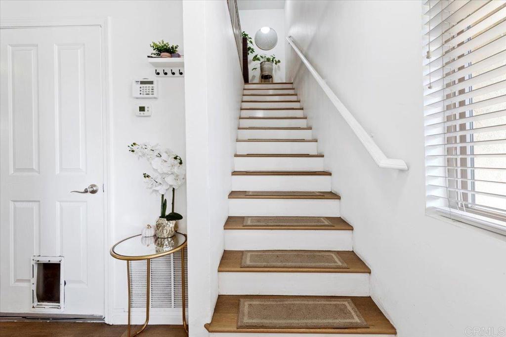 1069 Estes Street El Cajon, CA 92020 - Photo 5 of 35 a view of staircase with white walls and a window