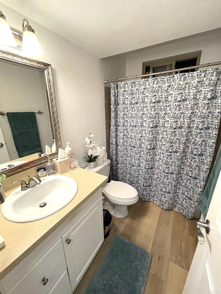 1069 Estes Street El Cajon, CA 92020 - Photo 7 of 41 a bathroom with a sink a toilet and shower
