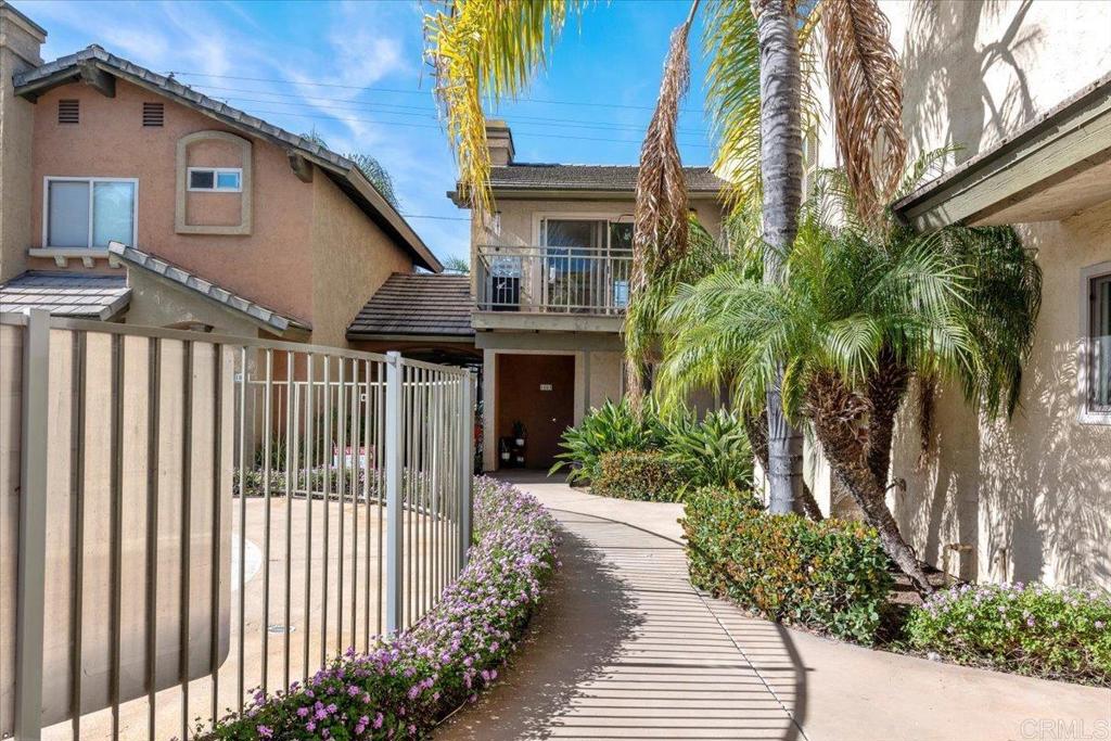 1069 Estes Street El Cajon, CA 92020 - Photo 8 of 35 a view of a house with a small yard next to a house