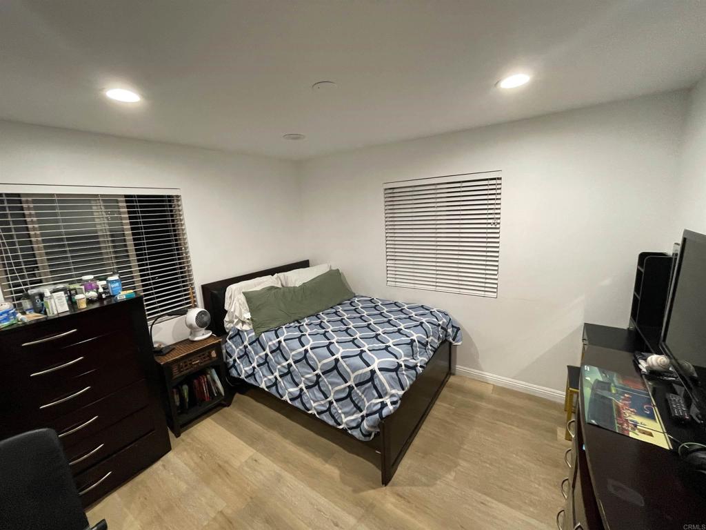 1069 Estes Street El Cajon, CA 92020 - Photo 8 of 41 a bedroom with a bed window and a television
