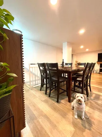 a view of a dinning table and chairs in the patio