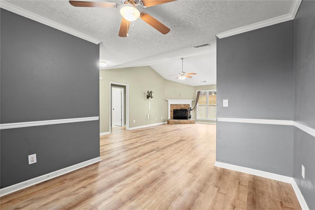 923 Downing Drive Bethlehem, GA 30620 - Photo 13 of 39 wooden floor in an empty room with a window