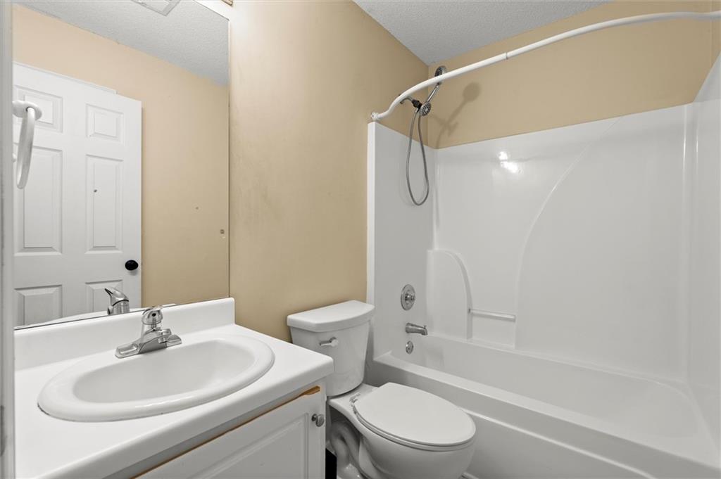 923 Downing Drive Bethlehem, GA 30620 - Photo 16 of 39 a bathroom with a sink toilet and shower