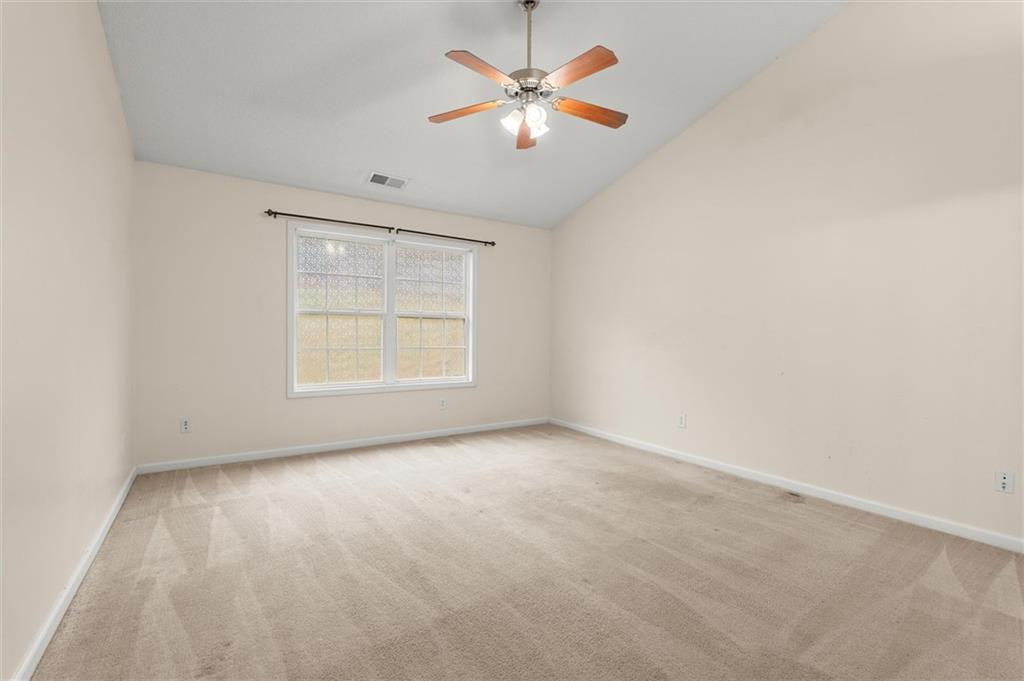 923 Downing Drive Bethlehem, GA 30620 - Photo 20 of 39 an empty room with windows and fan