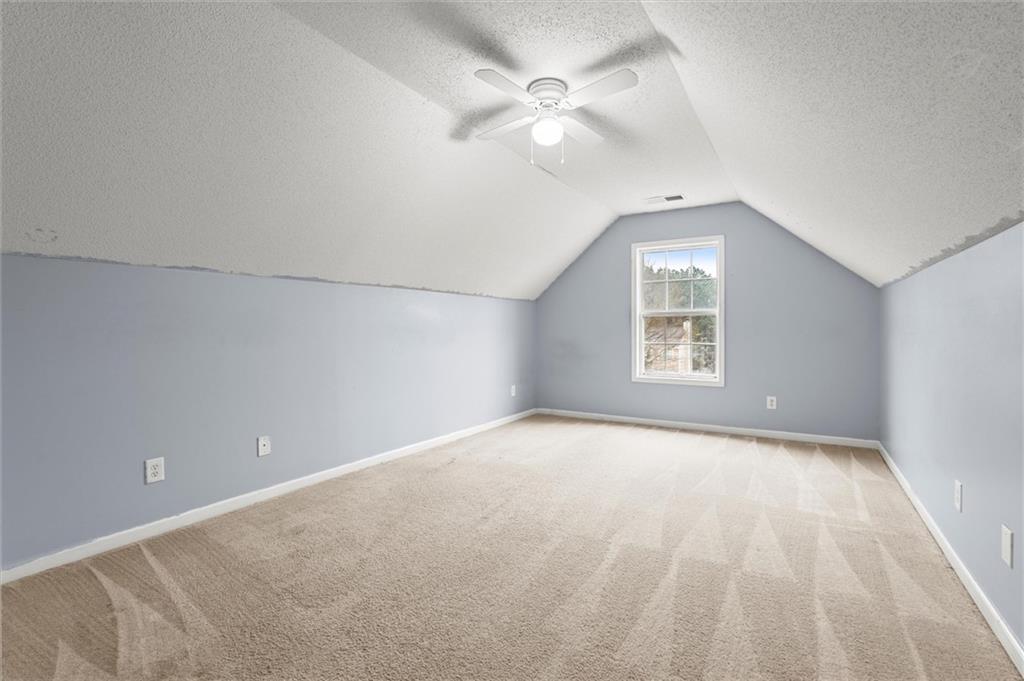 923 Downing Drive Bethlehem, GA 30620 - Photo 26 of 39 an empty room with windows and ceiling fan
