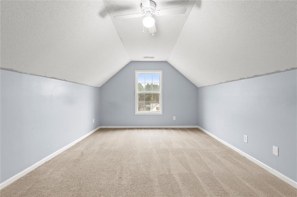 923 Downing Drive Bethlehem, GA 30620 - Photo 27 of 39 wooden floor in an empty room with a window