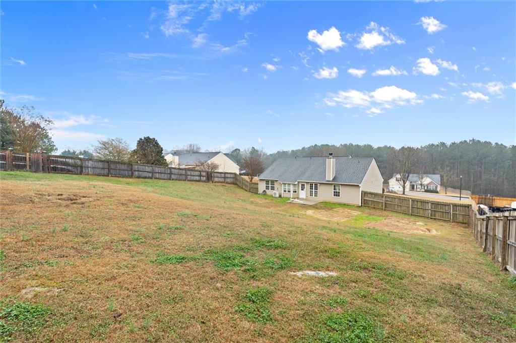 923 Downing Drive Bethlehem, GA 30620 - Photo 31 of 39 a view of a lake with a city