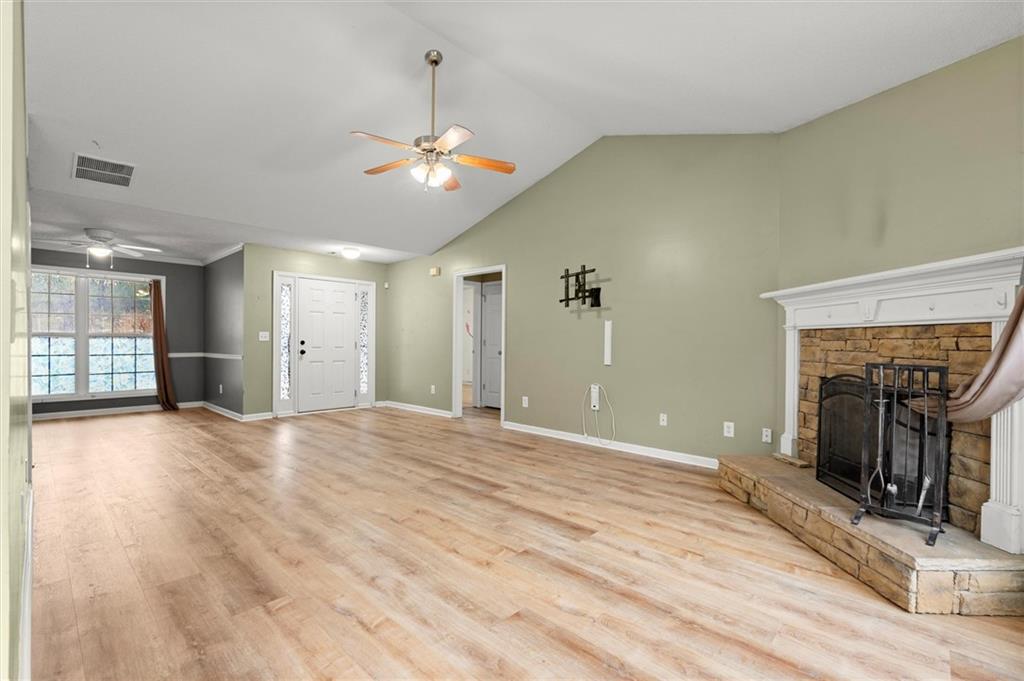 923 Downing Drive Bethlehem, GA 30620 - Photo 5 of 39 a view of a livingroom with a fireplace and chandelier