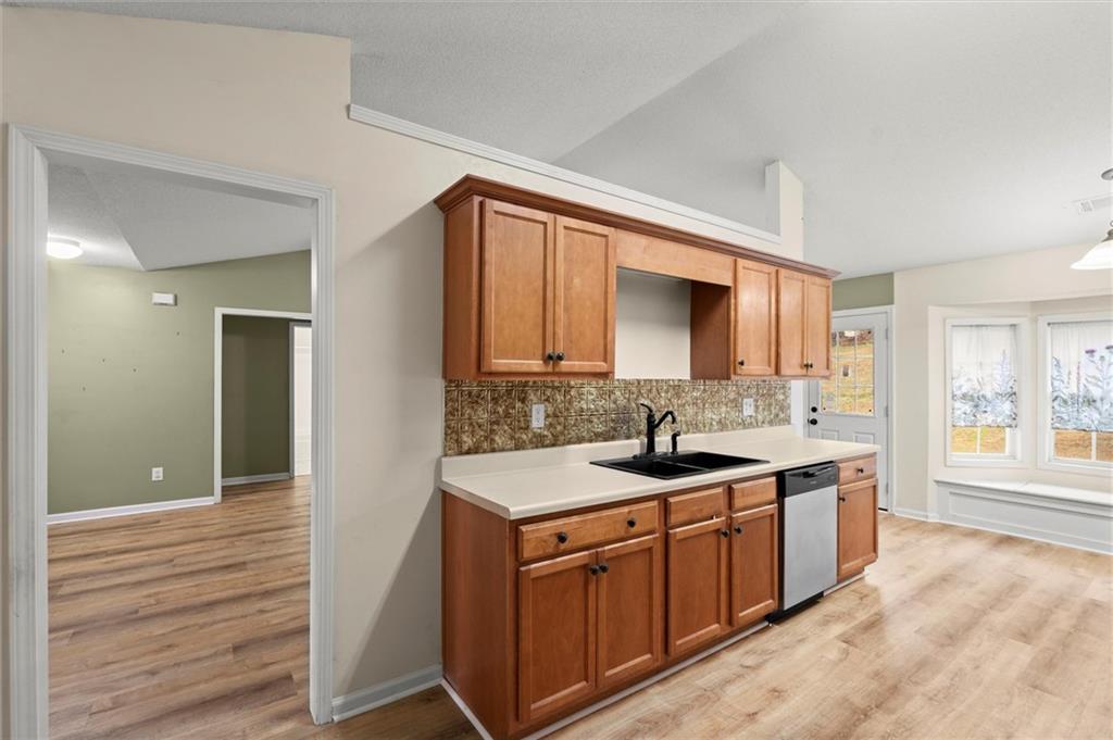 923 Downing Drive Bethlehem, GA 30620 - Photo 10 of 39 a bathroom with a granite countertop sink and a mirror